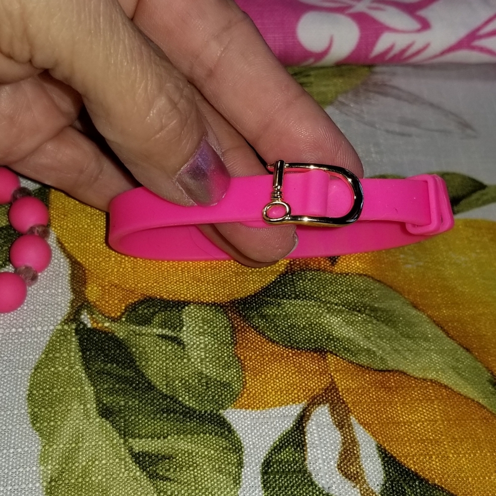 "Keep" brand hot pink silicone buckled bracelet with gold buckle